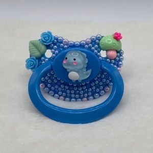Blue dinosaur adult pacifier